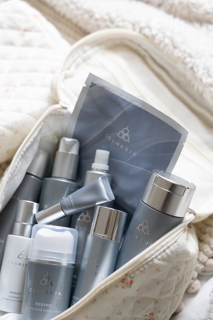 services-02 A selection of skincare products neatly arranged in a quilted travel bag for easy access.